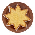 Star shape slice of pandoro, Italian sweet yeast bread, traditional Christmas treat. Overhead flat lay view. Isolated on