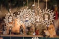 Star shaped and bell shaped wooden Christmas ornaments and small angels Royalty Free Stock Photo