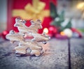 Star shaped christmas decoration with christmas decoration in the background