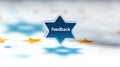 Star shaped icon with feedback text on a blurred background Royalty Free Stock Photo