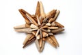 a star-shaped ornament made of driftwood pieces on a white background
