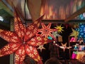 Star-shaped Paper lamp shades in a stall at a Christmas Market near Liverpool Lime Street Train Station