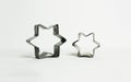 Star shaped pastry cutters on a white background - horizontal Royalty Free Stock Photo