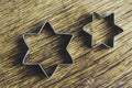 Star shaped pastry cutters on a wooden background - horizontal Royalty Free Stock Photo