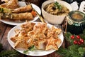 Star shaped puff pastry pies fried carp and sauerkraut with mushrooms for Christmas Eve supper in Poland