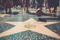 Star on the sidewalk of Hollywood Boulevard in Los Angeles during the tourist season