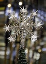 Star snowflake Christmas tree on blurred background