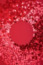 Star sprinkles on red with round space. Royalty Free Stock Photo