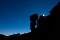 Star sun behind iconic rocks in Tenerife