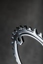 Star teeth pattern with bicycle chain mechanisms on black background. Royalty Free Stock Photo