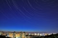 Star tracks over night Kiev cityscape Royalty Free Stock Photo