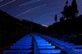 Star Trail and Blue Light Flume Royalty Free Stock Photo