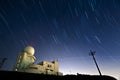Star trails hovering above a weather radar station Royalty Free Stock Photo