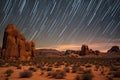 star trails and meteors over a desert scene