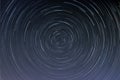 Star trails in a night sky long exposure style realistic circular star arcs pattern