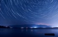 Star trails over the lake Royalty Free Stock Photo