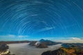 Star trails over the volcano. Clouds. Night Royalty Free Stock Photo