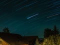 Star trails on the roofs of a Swiss village in Summer