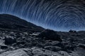 Star Trails on top of a rocky mountain