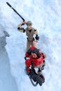 Star Wars LEGO action figures of Base Malbus and Rey Skywalker walking on snowy cliff
