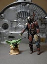 Star Wars The Mandalorian character Din Djarin with Grogun the child or baby Yoda