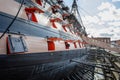 Starboard side of HMS Victory, Lord Nelson`s flagship, with cannons deployed in Portsmouth Historic Dockyard, Hampshire, UK