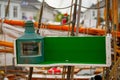 Starboard side lantern on an old, wooden boat