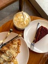 Starbucks caramel frappuccino, red velvet cake and almond croissant in coffee in Surabaya.