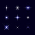Starburst, stars and sparkles burst glowing light effect on black background.