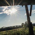 Starburst Sun Under the Eve of an Open Air Barn