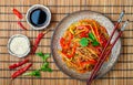 Starch rice, potato noodles with vegetables - bell peppers, carrots, cucumber, sesame seeds, cilantro and soy sauce Royalty Free Stock Photo