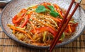 Starch rice, potato noodles with vegetables - bell peppers, carrots, cucumber, sesame seeds, cilantro and soy sauce Royalty Free Stock Photo