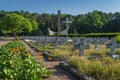 Monument and rows of graves. Military cemetery for fallen soldiers from 1st Polish Army