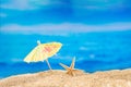 Starfish on beach on sand with sun umbrella. Sea. Concept of recreation, tourism Royalty Free Stock Photo