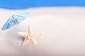 Starfish on the beach under an umbrella Royalty Free Stock Photo