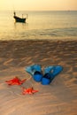 Starfish and flippers on sea sand sunset Royalty Free Stock Photo