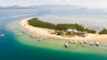 Starfish Island, Puerto Princesa, Palawan.Lots of boats on the beach, tourist route. Island hopping Tour at Honda Bay Royalty Free Stock Photo