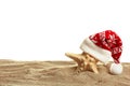 Starfish in a New Year's cap standing on sand Royalty Free Stock Photo