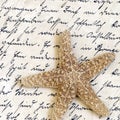 Starfish on old letter Royalty Free Stock Photo