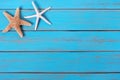 Starfish old worn blue beach tropical wood deck background border