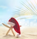 Starfish in Santa hat on the summer beach. Christmas concept Royalty Free Stock Photo