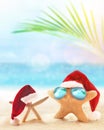 Starfish in Santa hat on the summer beach. Christmas concept Royalty Free Stock Photo