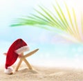 Starfish in Santa hat on the summer beach. Christmas concept Royalty Free Stock Photo