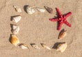 Starfish and sea shells with sand Royalty Free Stock Photo