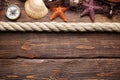 Starfish, seashell, fishing net, rope and compass Royalty Free Stock Photo