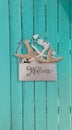 Starfish and seashell welcome basket decor on an aqua blue