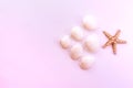 Starfish and seashells on a pink background. Flat lay beach essentials. Top view beauty photo. Royalty Free Stock Photo