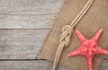 Starfish with ship rope and burlap Royalty Free Stock Photo