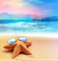 Starfish in sunglasses on the summer beach Royalty Free Stock Photo