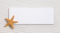 Starfish on a white sign in a sand background for summer Royalty Free Stock Photo